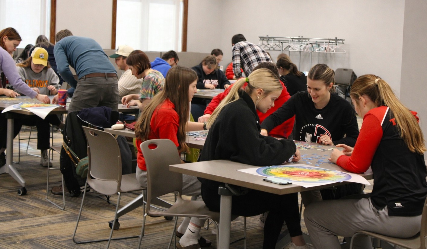 Puzzle enthusiasts race the clock at library jigsaw competition